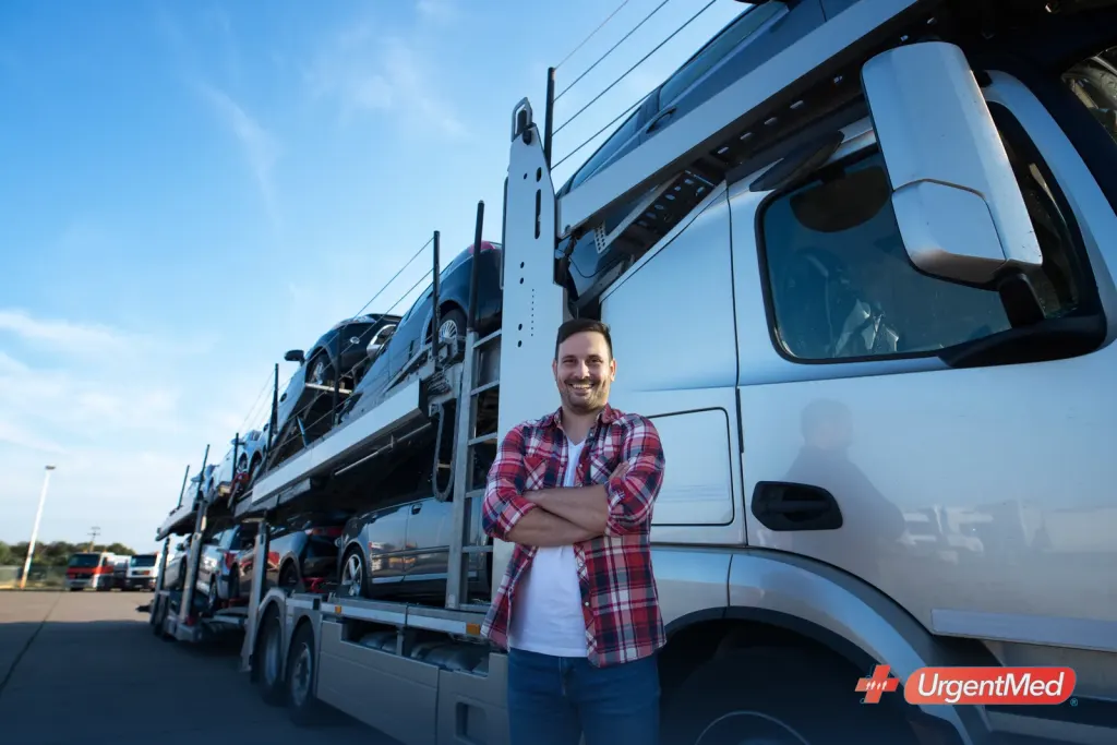 Commercial truck driver standing in front of his semi truck before a DOT physical