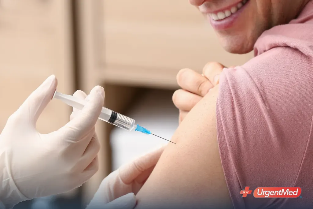 Patient receiving a flu shot in the upper arm