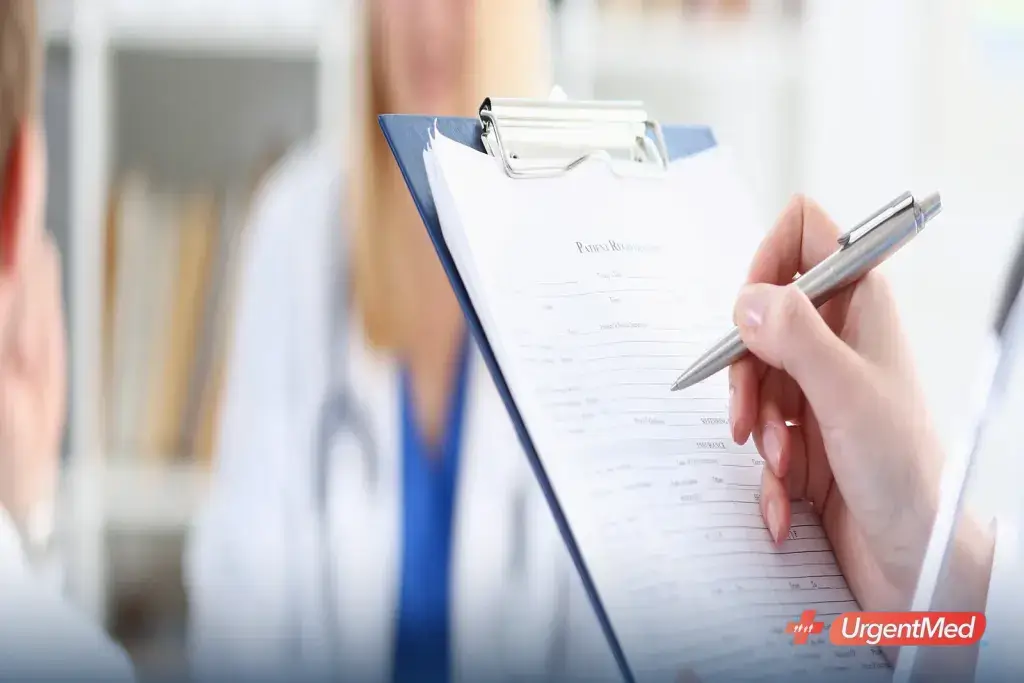 Provider completing medical clearance paperwork on a clipboard