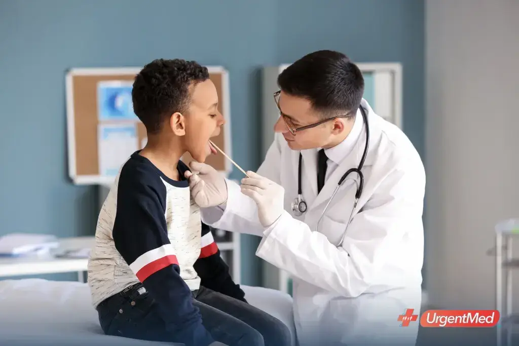 Pediatric provider examining a child