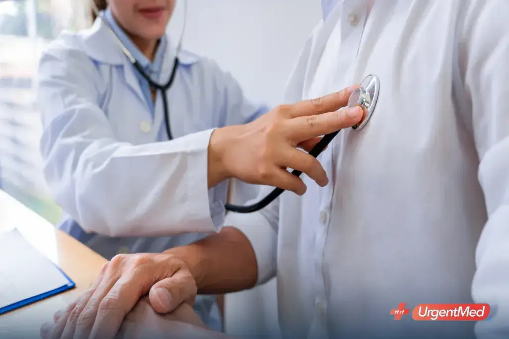 Provider performing a physical exam with a stethoscope